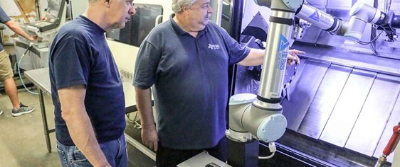 Man with collaborative robotic arm from Universal Robots.